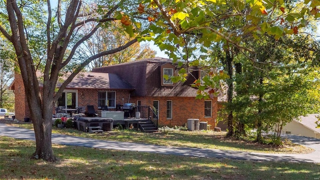 view of front of home with cooling unit