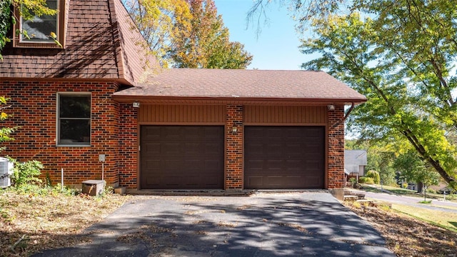 view of side of home with a garage