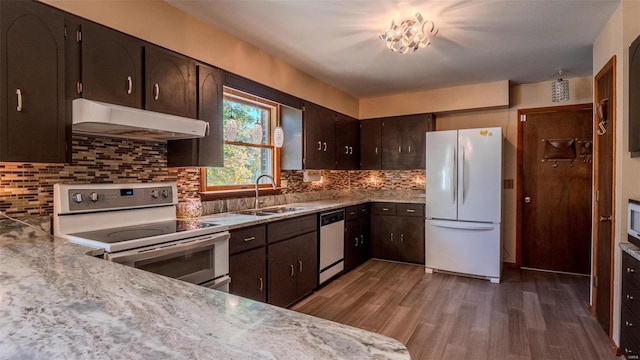 kitchen featuring sink, dishwasher, electric range oven, dark hardwood / wood-style flooring, and white refrigerator