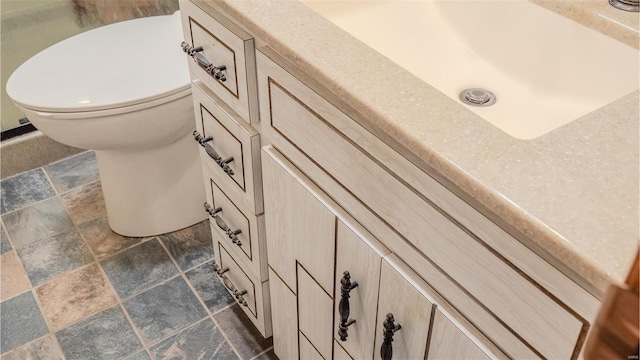 bathroom featuring toilet and sink