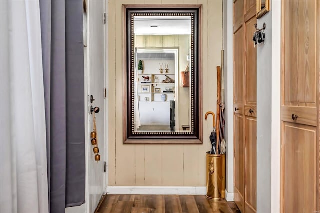 hallway with dark hardwood / wood-style flooring