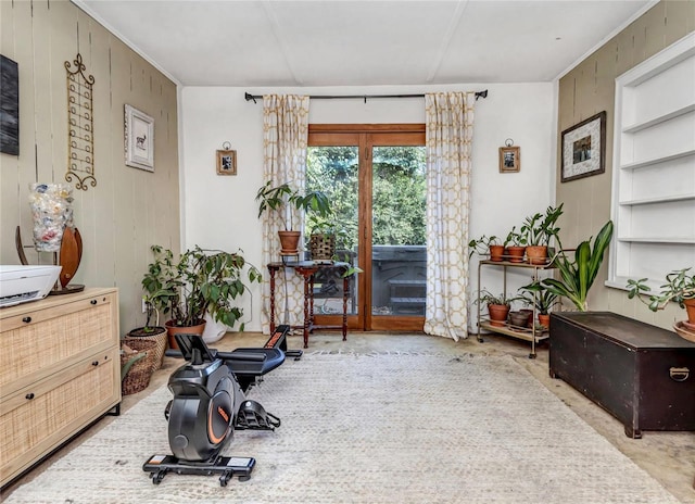 interior space with wood walls and concrete flooring