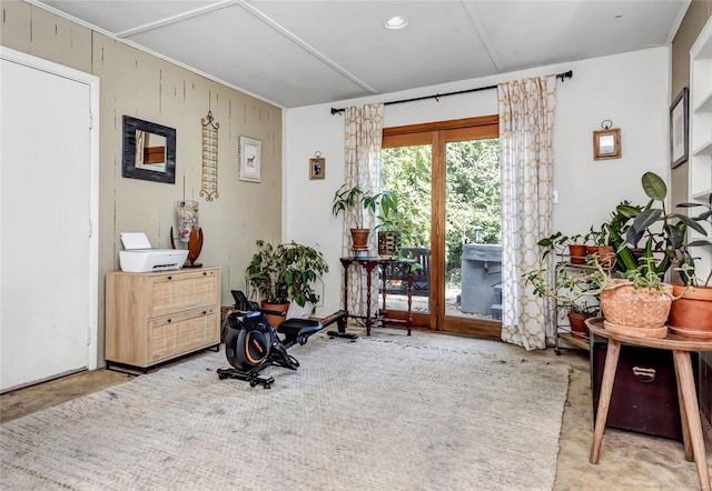 interior space with wooden walls and concrete flooring