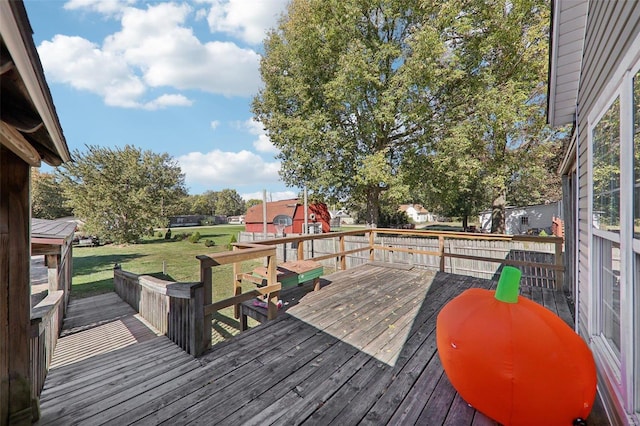 wooden deck with a yard