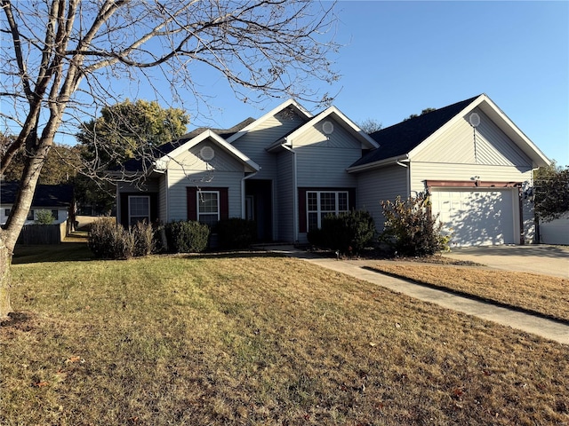 single story home featuring a front yard and a garage