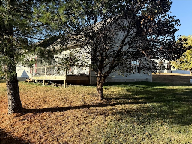 view of yard with a wooden deck