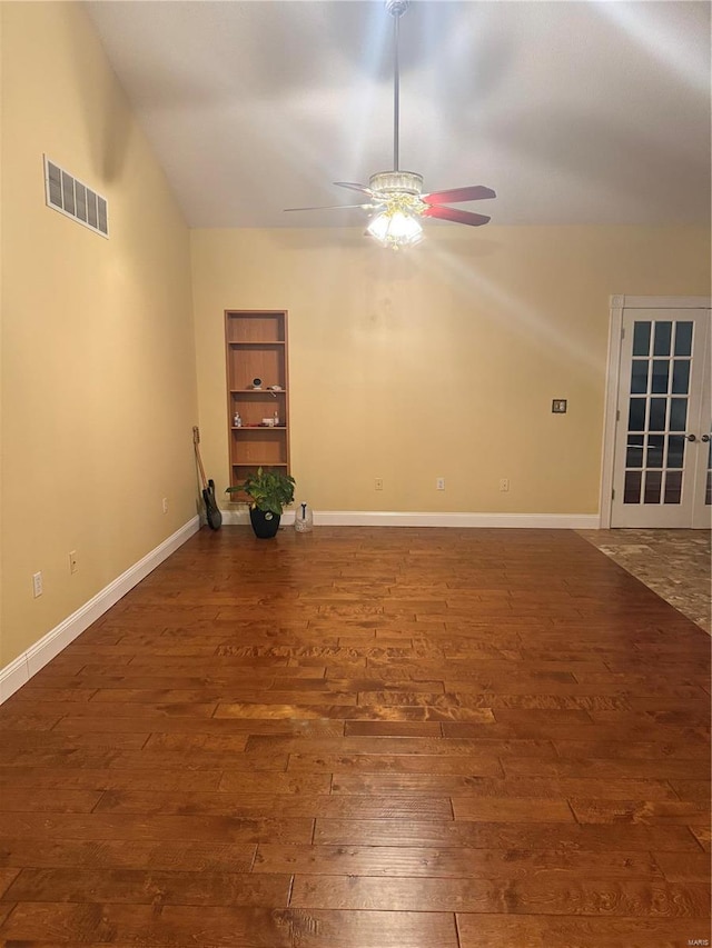 spare room with ceiling fan and dark hardwood / wood-style floors