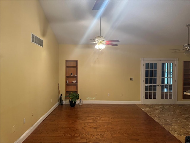 unfurnished room with lofted ceiling, french doors, wood-type flooring, and ceiling fan