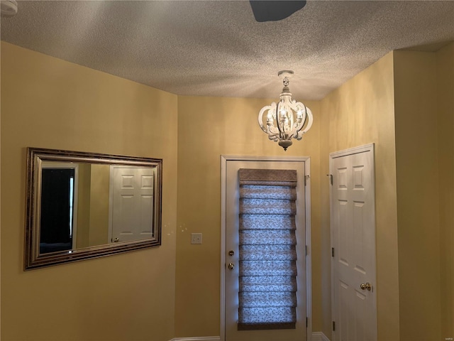 foyer with a textured ceiling