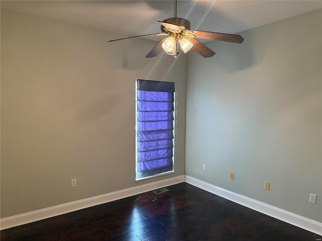 unfurnished room featuring a textured ceiling, ceiling fan, and dark hardwood / wood-style flooring