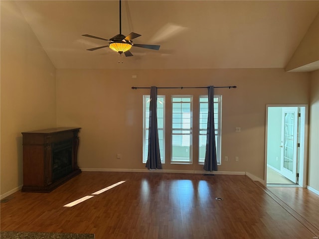 unfurnished living room featuring lofted ceiling, hardwood / wood-style floors, and ceiling fan