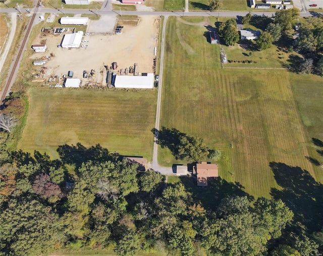 birds eye view of property with a rural view