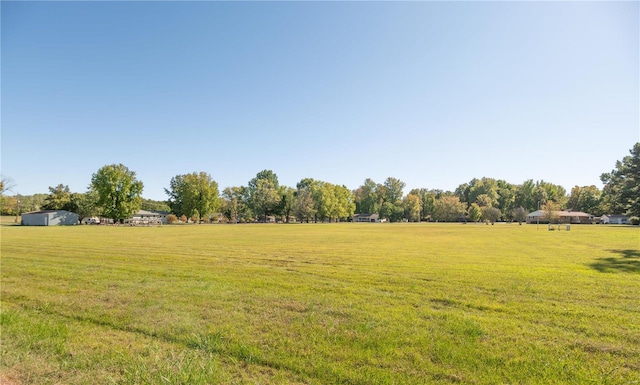 view of yard with a rural view