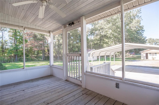 unfurnished sunroom featuring a healthy amount of sunlight and ceiling fan