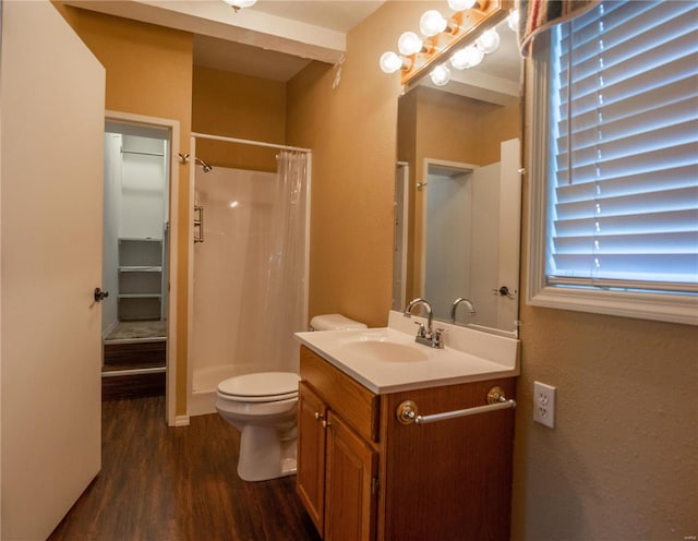 bathroom with vanity, toilet, a shower with shower curtain, and hardwood / wood-style floors