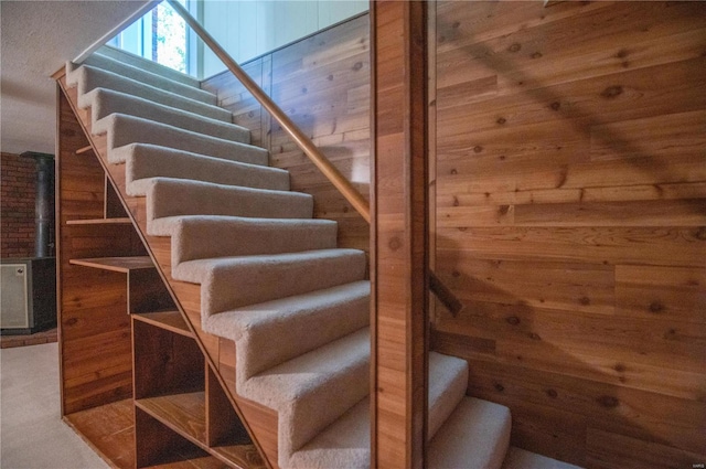 stairs with wood walls