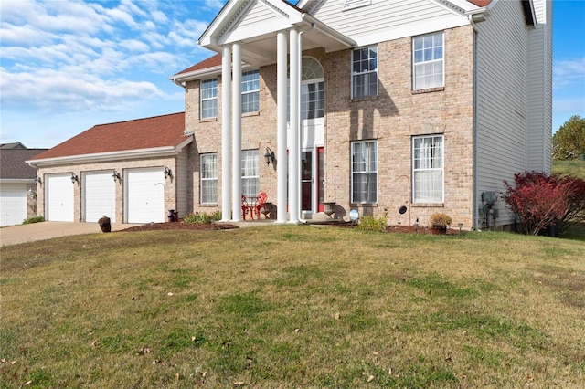 view of front facade with a garage and a front lawn