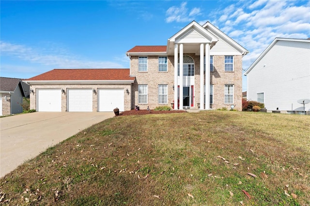 view of front of house featuring a front yard and a garage