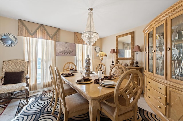 tiled dining area with an inviting chandelier