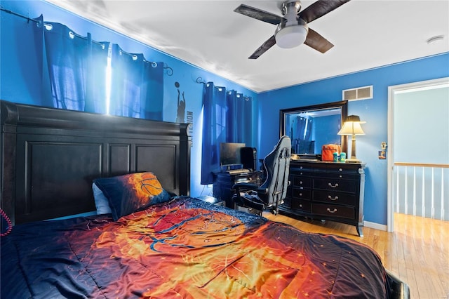 bedroom featuring ceiling fan and hardwood / wood-style floors