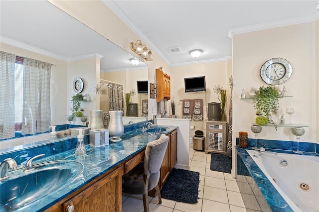 bathroom with vanity, crown molding, tile patterned floors, and tiled tub