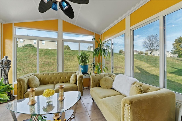 sunroom / solarium featuring vaulted ceiling, a healthy amount of sunlight, and ceiling fan