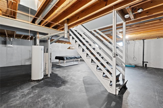 basement with electric panel and gas water heater