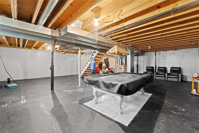 playroom featuring pool table, water heater, and concrete flooring