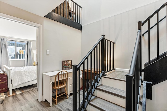 stairs featuring wood-type flooring