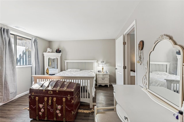 bedroom featuring dark hardwood / wood-style flooring