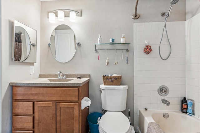 full bathroom with vanity, toilet, and tiled shower / bath