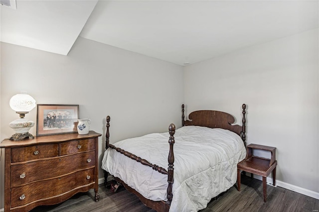 bedroom featuring dark hardwood / wood-style flooring