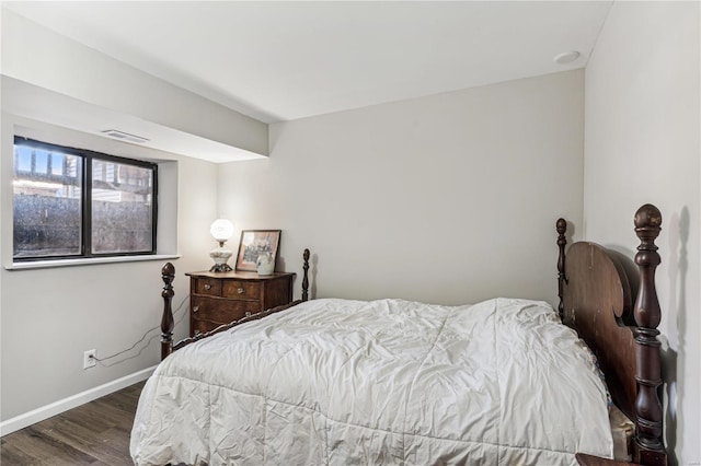 bedroom featuring dark wood-type flooring