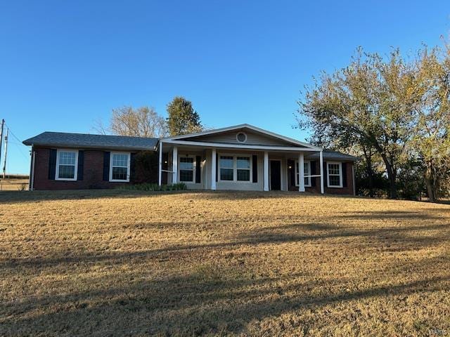 ranch-style home with a front yard