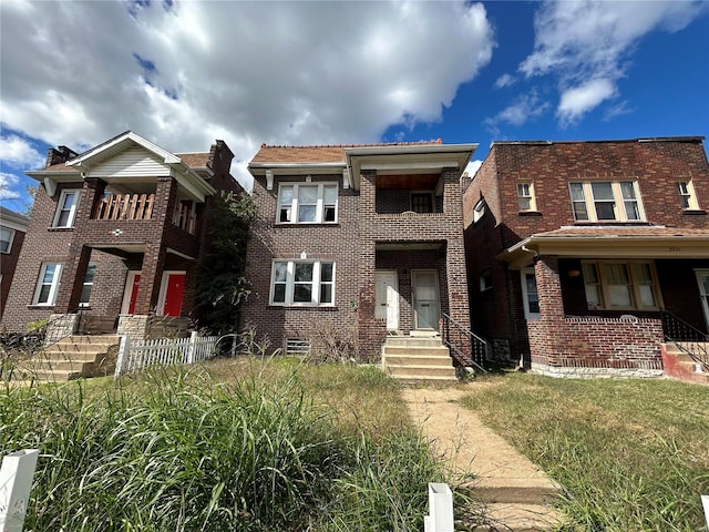 view of front of property with a balcony