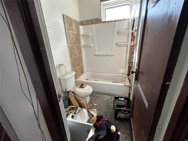 bathroom with toilet and shower / bathtub combination