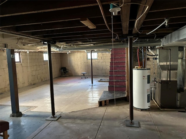 basement featuring heating unit and water heater