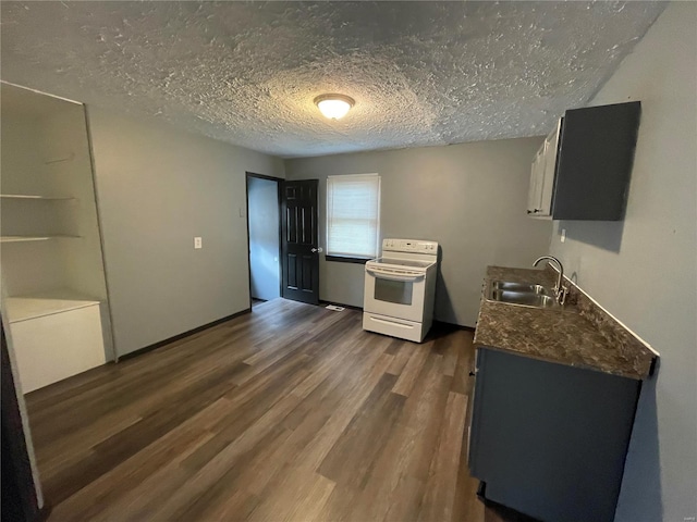 kitchen with sink, a textured ceiling, white cabinetry, white electric range, and dark hardwood / wood-style floors