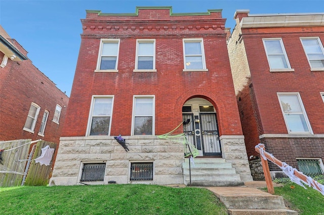 view of front of home with a front yard