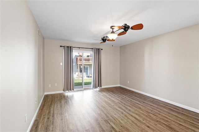 spare room with ceiling fan and hardwood / wood-style flooring