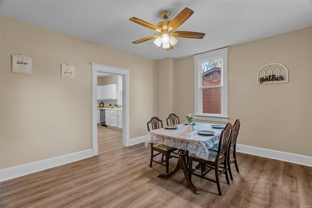 dining room featuring ceiling fan and light hardwood / wood-style flooring