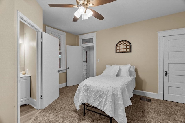 bedroom with light carpet and ceiling fan