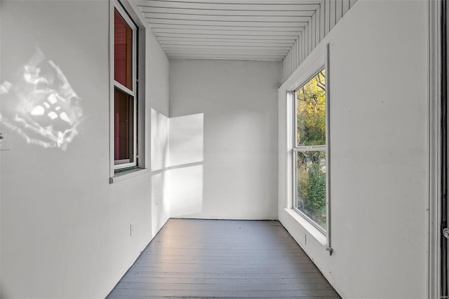 unfurnished sunroom with wooden ceiling