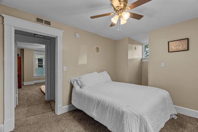 bedroom with light carpet and ceiling fan