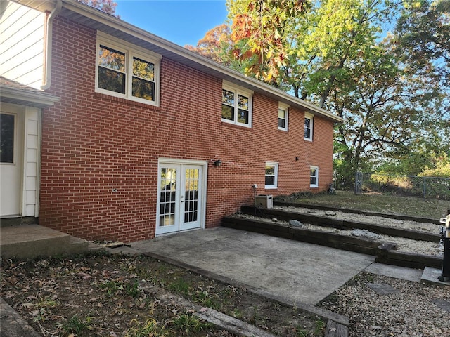 back of property featuring a patio, french doors, and central AC unit