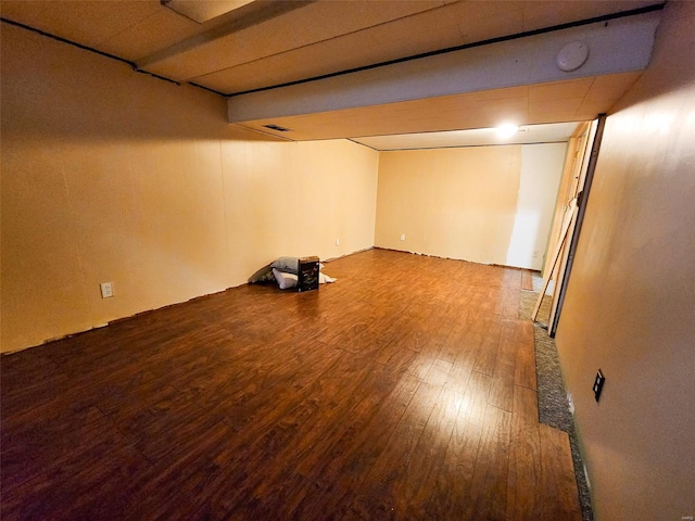 basement with hardwood / wood-style floors