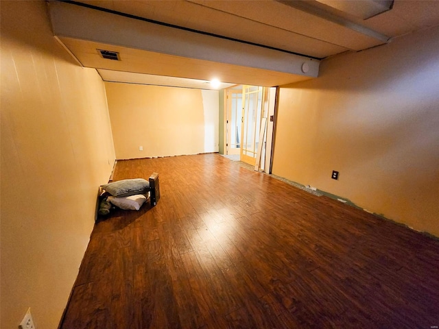 basement with hardwood / wood-style flooring