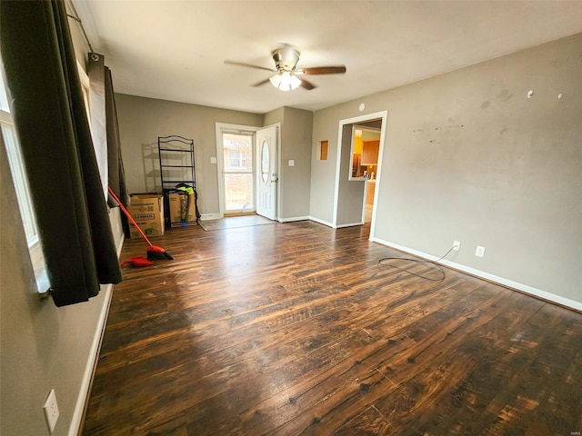 empty room featuring dark hardwood / wood-style floors and ceiling fan