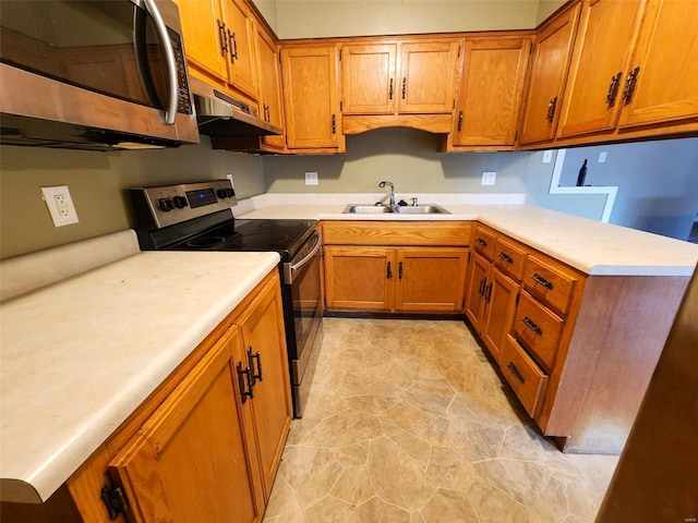 kitchen with sink and appliances with stainless steel finishes