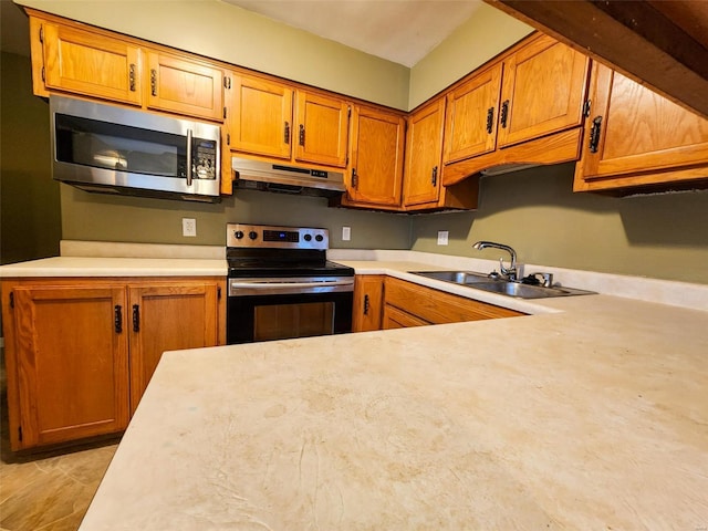 kitchen with sink and stainless steel appliances